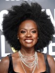 Viola Davis smiles for photographers at a red carpet event